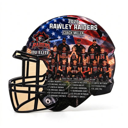 A custom football helmet with a printed 2026 Rawley Raiders Coach Miller team photo and player list. The helmet features a black faceguard, a black and white team photo of the players, and an American flag pattern on the back with team logos and text.