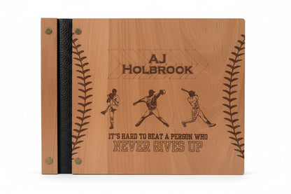 Wooden plaque with engraved text and illustrations of a baseball player on a wooden surface.